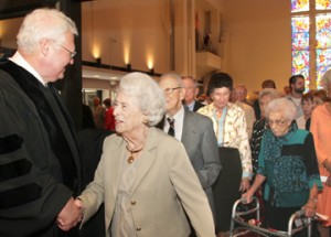 Parishioners gathered at First Presbyterian Church in Delray Beach to celebrate the 25th year anniversary of Dr. Ted Bush.  Pictured, members of the parish congratulate Dr. Ted Bush after mass.   photo by tim stepien